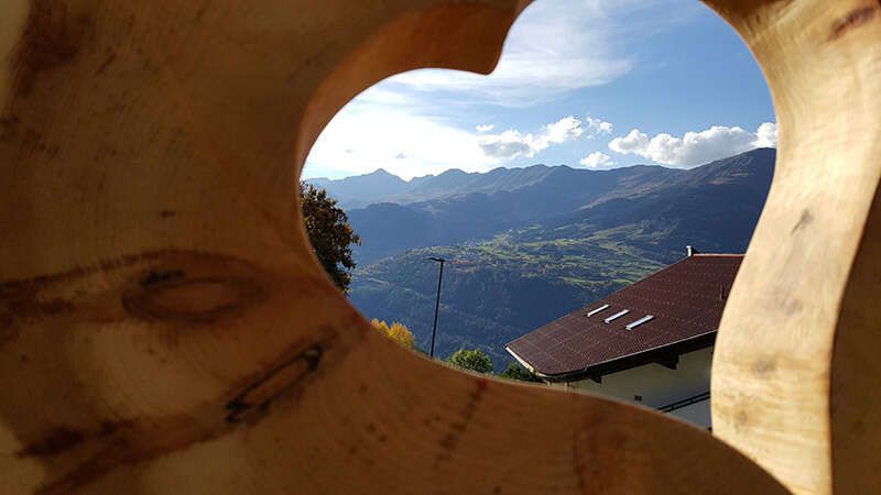 Wooden heart with a view of Fendels from the Walch guest house